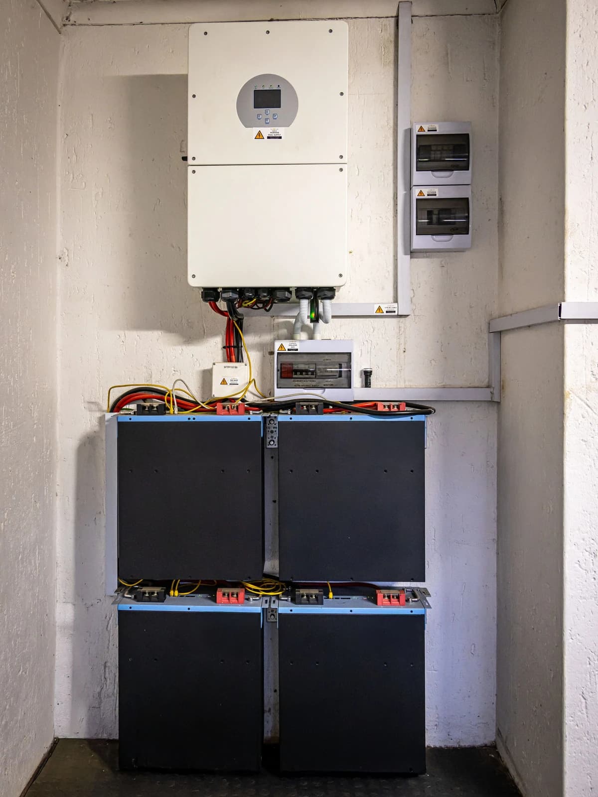 Residential inverter above stacked battery modules